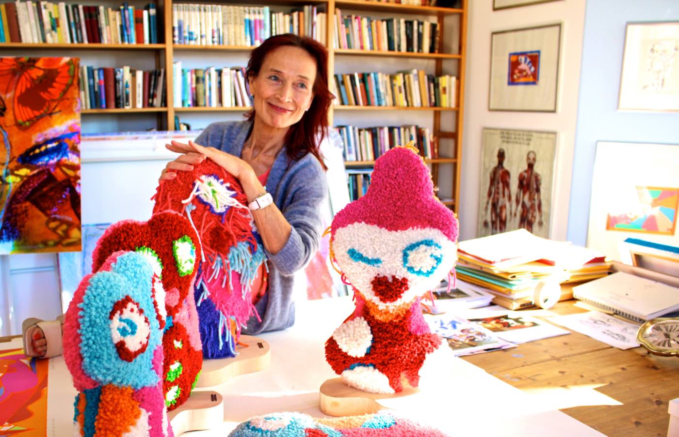 Artist Riitta Nelimarkka and colorful, woolen statuettes depicting Elise, her alter ego.